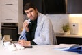 Man working from home with a cold Royalty Free Stock Photo