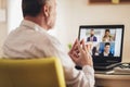 Man working from home having online group videoconference Royalty Free Stock Photo