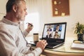 Man working from home having online group videoconference