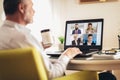 Man working from home having online group videoconference Royalty Free Stock Photo