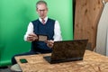 Man working from home in his basement on a virutal meeting. Royalty Free Stock Photo