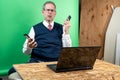 Man working from home in his basement on a virutal meeting. Royalty Free Stock Photo