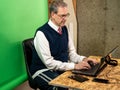 Man working from home in his basement on a virutal meeting Royalty Free Stock Photo