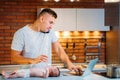 Man working from home and taking care of baby Royalty Free Stock Photo