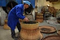 ANHUI PROVINCE, CHINA Ã¢â¬â CIRCA OCTOBER 2017: Men working inside a tea factory Royalty Free Stock Photo