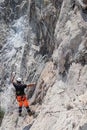 Man working on the installation of a rockfall protection mesh