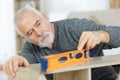 man working on installation using leveling tool Royalty Free Stock Photo