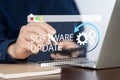Man working and installing update process. Software updates or operating system upgrades to keep your device up Royalty Free Stock Photo