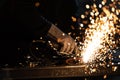 Man working on iron with grinder Royalty Free Stock Photo