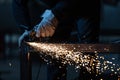 Man working on iron with grinder Royalty Free Stock Photo
