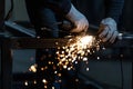 Man working on iron with grinder Royalty Free Stock Photo