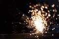 Sparkles and fire from grinder cutting Royalty Free Stock Photo