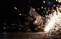 Sparkles and fire from grinder cutting Royalty Free Stock Photo