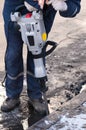 Man working a jackhammer on a city street Royalty Free Stock Photo