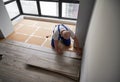 Man working on laminate flooring installation in apartment. Royalty Free Stock Photo