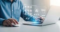 Man working on laptop with AI interface, showcasing advanced technology and digital transformation Royalty Free Stock Photo