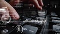 Man working on laptop computer keyboard with graphic user interface GUI hologram Royalty Free Stock Photo