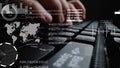 Man working on laptop computer keyboard with graphic user interface GUI hologram Royalty Free Stock Photo