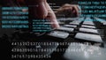 Man working on laptop computer keyboard with graphic user interface GUI hologram Royalty Free Stock Photo