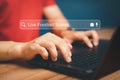 Man working a laptop on desk in home. Searching Browsing Internet Data Information with search.