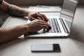 Man working on a laptop. Graphics tablet, mobile phone