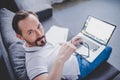 Man working on laptop at home Royalty Free Stock Photo