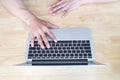 Man working with laptop, man`s hands on notebook computer, business person at workplace Royalty Free Stock Photo