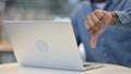 Man Working on Laptop and Showing Thumbs Down, Close Up Royalty Free Stock Photo