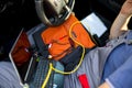 Man working on laptop while sitting in a car in workshop, close Royalty Free Stock Photo