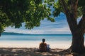 Man Working on Laptop on Tropical Beach Royalty Free Stock Photo