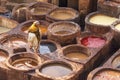 Man working in the leather tanneries in Fes, Morocco. Royalty Free Stock Photo