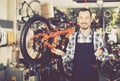Man working on master mechanic assembling bicycle equipment Royalty Free Stock Photo