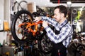 Man working on master mechanic assembling bicycle equipment Royalty Free Stock Photo