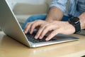 Man working on modern laptop at table indoors, closeup Royalty Free Stock Photo