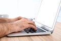 Man working with modern laptop at table indoors, closeup Royalty Free Stock Photo