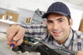 man working on new kitchen installation Royalty Free Stock Photo