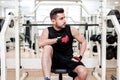 Man working out at gym, resting at bench press Royalty Free Stock Photo