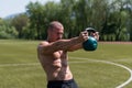 Man Exercising With Kettle Bell Outdoors Royalty Free Stock Photo