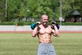 Muscular Man Exercising With Kettle-bell Outdoor Royalty Free Stock Photo
