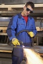 Man working with plasma cutter