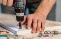 Man working during process of furniture manufacturing