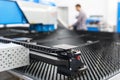 Man working at programmable CNC machine Royalty Free Stock Photo