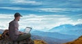 Man working remotely outdoors with laptop Royalty Free Stock Photo