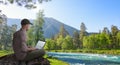 Man working remotely outdoors with laptop Royalty Free Stock Photo