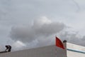 Sidi Ifni, Morocco: 27/05/2013: A man working on roof.