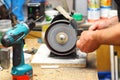 Man working with sharpening machine tool