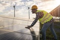 Man working for solar panels and wind turbines - Renewable energy concept - Focus on male worker hands Royalty Free Stock Photo