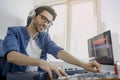 Man is working on sound mixer in recording studio or DJ is working in broadcasting studio. music producer is composing a Royalty Free Stock Photo