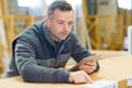 man working on tablet in workshop Royalty Free Stock Photo