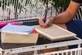 Man working via smartphon and reading book